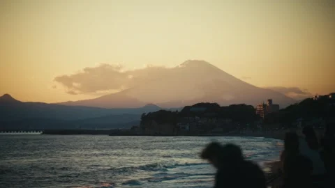 People Watching Sunset Over Mount Fuji at Shichirigahama Beach, Japan Stock Footage 344073334