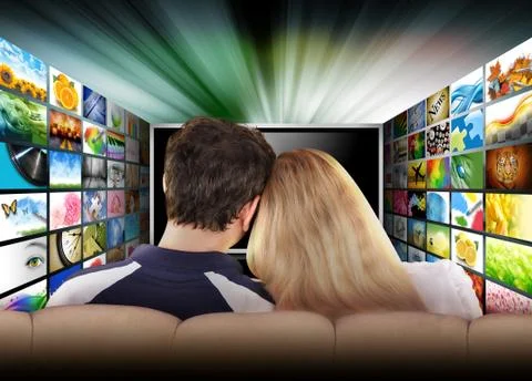 People watching television movie screen Stock Photos