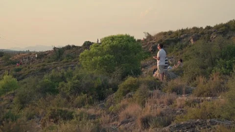 People watching a total solar eclipse from a mountain top Stock Footage 342277963