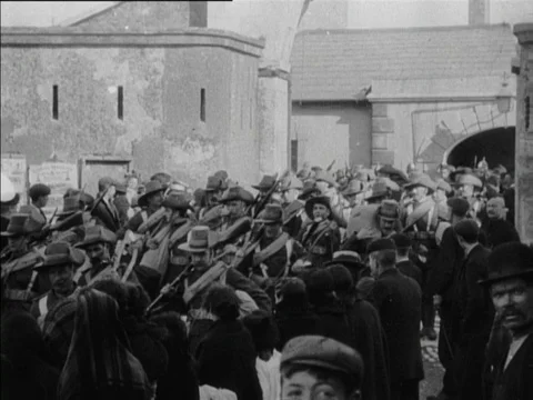 People watching troops leaving barracks, marching and playing instruments, 1902 Video stock 136682867