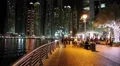 People on the waterfront, night Dubai Marina, United Arab Emirates HD Footage