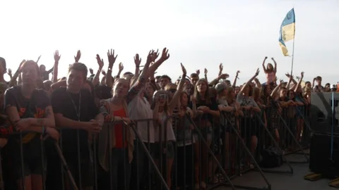 People Waving And Clapping Hands At Concert, Enjoying Music Stockbeeldmateriaal 89493060