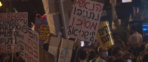People waving posters in hebrew Stock Footage 152849121