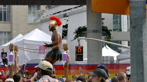 People wearing costumes dancing on float during gay pride parade Stock Footage 88417127