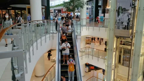 People Wearing Face Masks Inside Large Shopping Mall To Prevent Covid-19 Spread Stock Footage 130663757