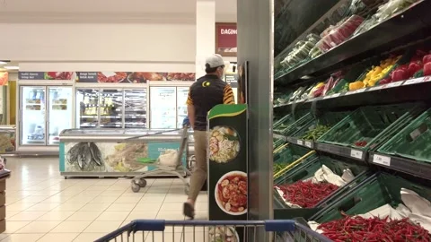 People wearing face masks while shopping at the supermarket Tesco Lotus store. Stock Footage 150199891