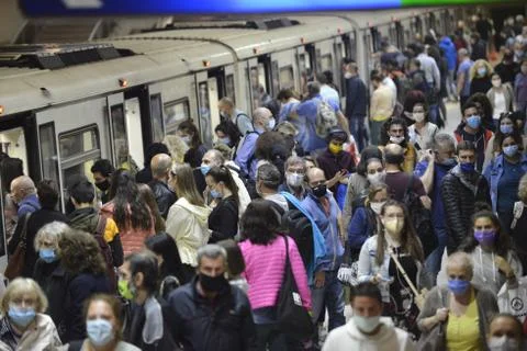 People wearing masks in subway Stock Photos