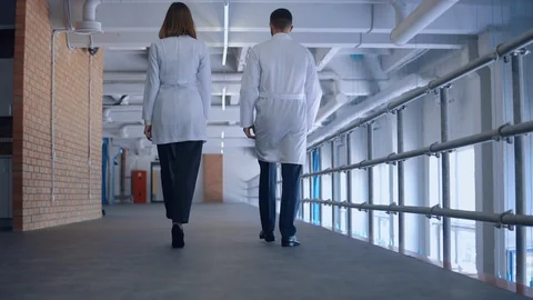 People wears uniform walks at work Stock Footage 101480492