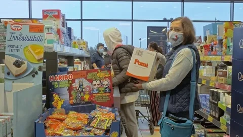 People While Wears Mask Stand In Queue To Checkout Line During Covid-19 Stock Footage 141920854
