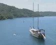 People windsurfing and kayaking round moored gulet SD Footage