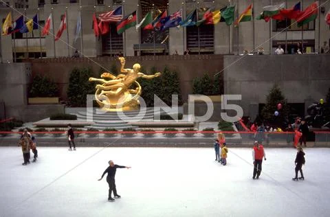 People winter center plaza iceskating flags new Stock Photos