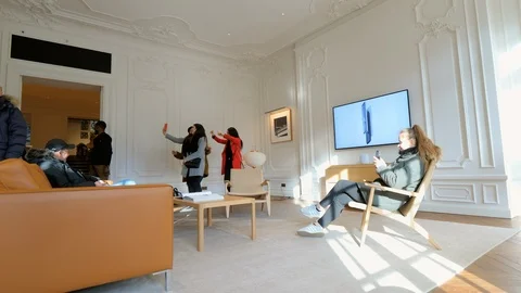 People women dancing making selfies inside Experience Room Apple Store Stock Footage 116884053