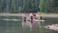 People on wooden raft, Synevyr lake in Carpathian Mountains, Ukraine HD Footage