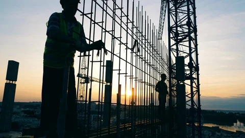 People work at a construction site, building a house. Stock-Footage 116328355