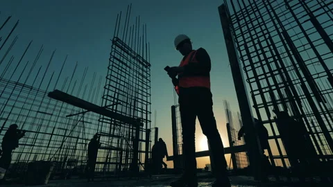 People work on construction site on sunset background. Video stock 131165379