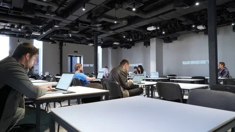 People work on laptops at coworking Stock Footage 86281277