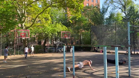 People work out at Tompkins Square Park in East Village in New York City. Stock Footage 316254418