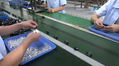 People at work on the production line of an electronics factory in China Video stock 60688777