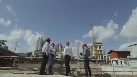 People Work Together On A Construction Site, Checking Unfinished Building.， Stock Footage 133341942