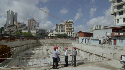 People Work Together On A Construction Site, Checking Unfinished Building.， Stock Footage 133342674
