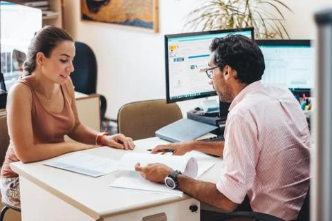 People working in a adviser's office Stock Photos