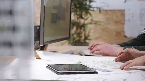 People working on blueprints in architecture office Stock Footage 149242552