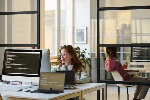 People working with computers in IT office Stock Photos