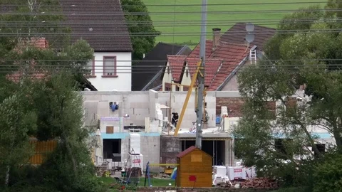 People working on a construction site in a small rural village in Germany Stock Footage 80088499