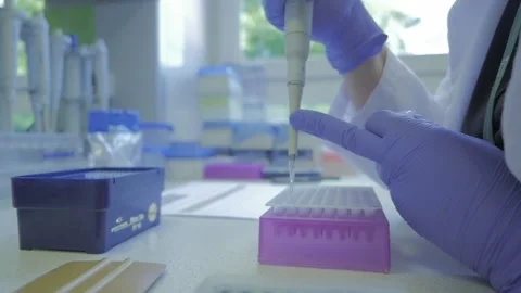 People working in a laboratory with dna and blood. Slow motion Stock Footage