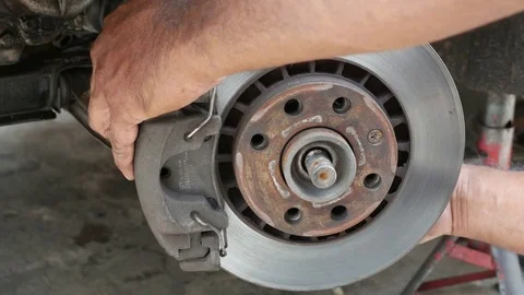 People working maintenance front disc brake car. Stock Footage 78072024