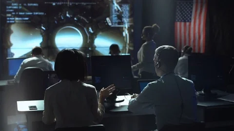 People working in mission control center Stock Footage 79078549