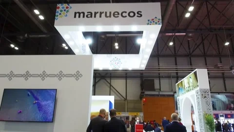 People working in the Morocco stand in FITUR 2022 Stock Footage 229685437