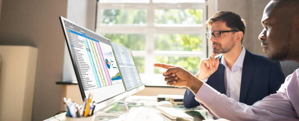 People Working With Spreadsheet Data Stock Photos