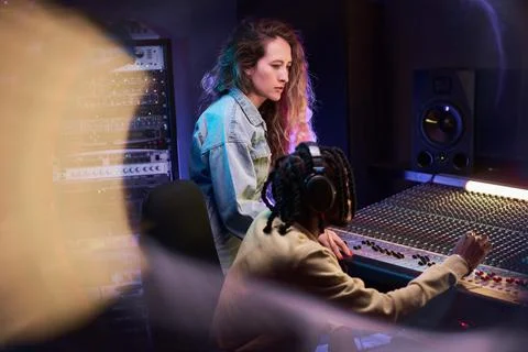 People working together in music studio Stock Photos