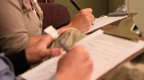 People writing notes on clipboards Stock Footage 20446570