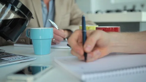 People Writing While Getting Poured Coffee Stock Footage 126700712