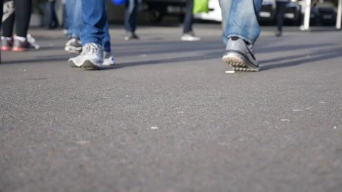 Peoples feet walking on concreate sidewalk Stock Footage 88960643