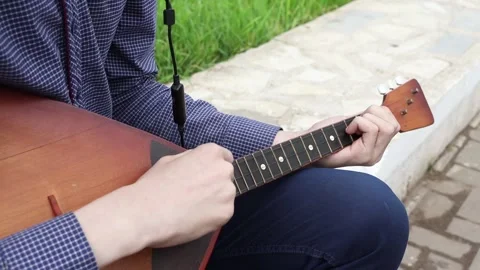 People's hands play musical instruments Stockbeeldmateriaal 336847267