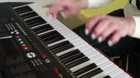 People's hands play musical instruments Stockbeeldmateriaal 336847268