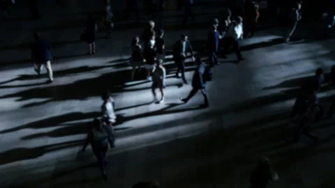 Peoples shadows move along a bustling city street under dramatic lighting Stock Footage 280134496