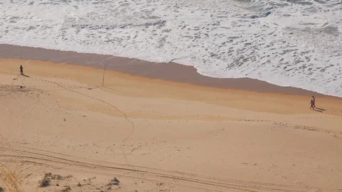 Peoples Walking on Ocean Beach Stock Footage 84769409