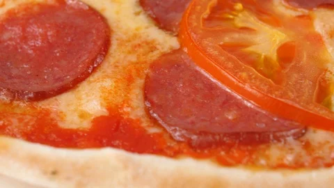 Peperoni pizza or with salami, sliced tomatoes, mozzarella cheese Stock Footage 87690126
