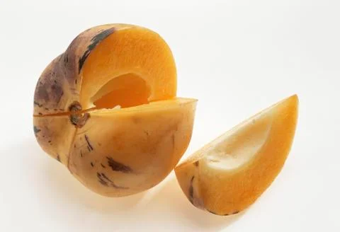 A pepino melon with a section removed Stock Photos