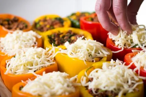 Peppars with cheese on top Stock Photos