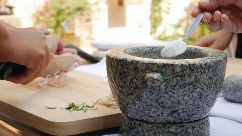Pepper and another spices in stone mortar with pestle for thai chili sauce Stock Footage 106181081