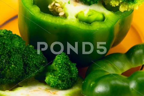 Pepper and broccoli on a plate Stock Photos
