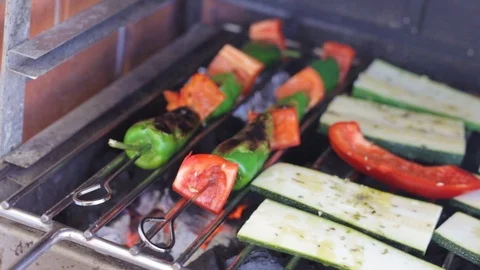 Pepper and courgette on grill on fire Stock Footage 116736610