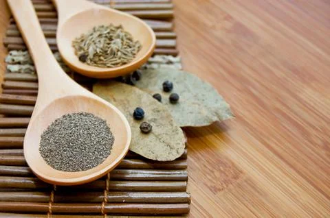 Pepper, bay leaf and cumin Stock Photos
