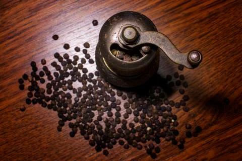 Pepper beans and grinder Stock Photos
