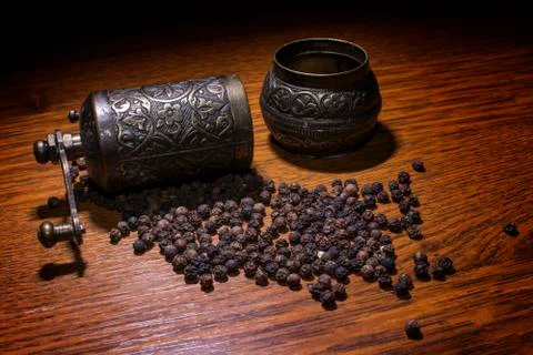 Pepper beans and grinder Stock Photos